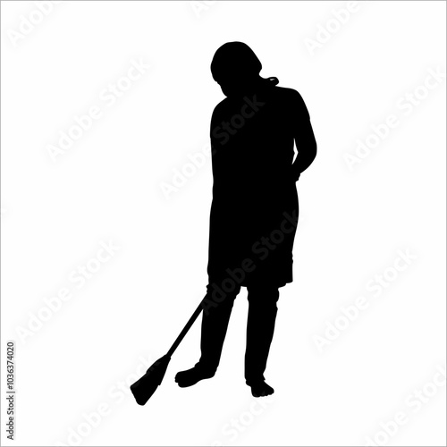 silhouette of a woman sweeping