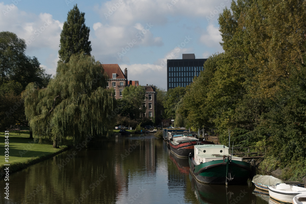 Quiet canal with colorful boats on the edge of Roeterseiland Campus - 1 Quiet canal with colorful boats on the edge of Roeterseiland Campus - 1