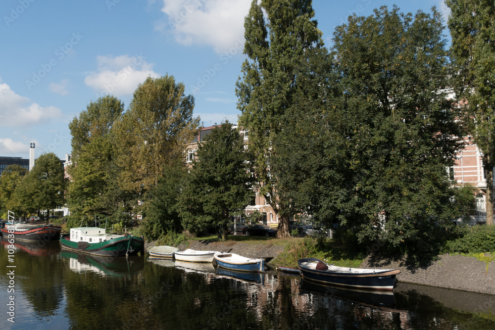 Quiet canal with colorful boats on the edge of Roeterseiland Campus - 2 Quiet canal with colorful boats on the edge of Roeterseiland Campus - 2