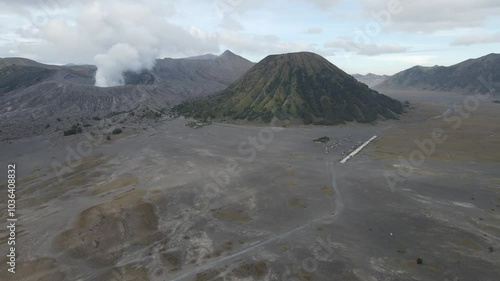 View of Mount Bromo and Mount Batok seen from a height. Bromo Tengger Semeru National Park is a very famous natural tourist area located in Probolinggo, East Java, Indonesia.