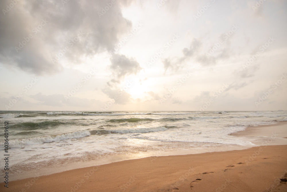 Landscape by the sea. Long deserted beach with water views to the horizon. The waves of a storm break on the sand and give the picture a special touch at sunset. ´ Bentota, Sri Lanka, Asia Landscape by the sea. Long deserted beach with water views to the horizon. The waves of a storm break on the sand and give the picture a special touch at sunset. ´ Bentota, Sri Lanka, Asia
