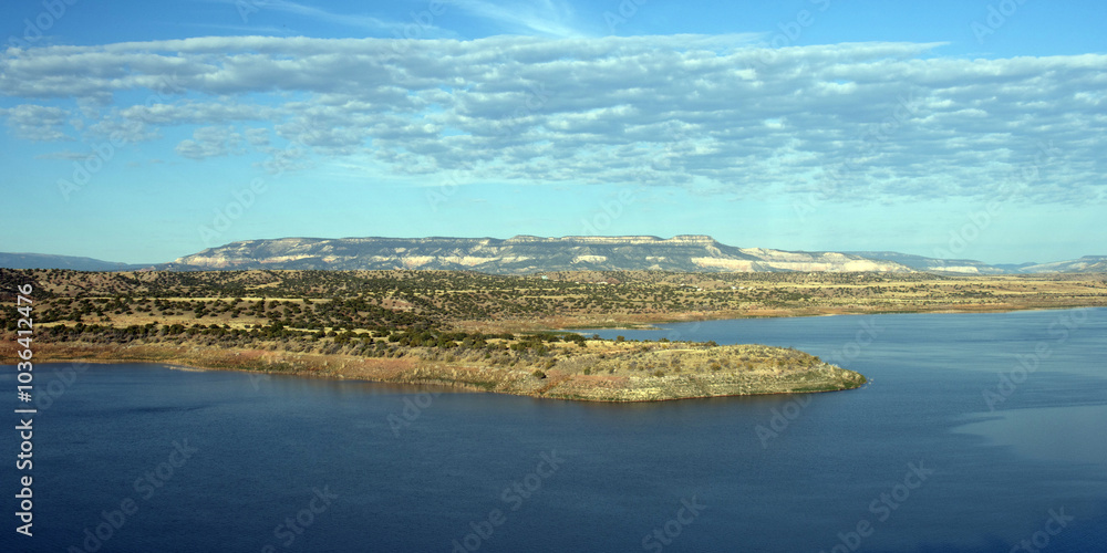 Wide panoramic view of Abiquiu Lake, an Army Corps of Engineers reservoir in northern New Mexico, at dawn Wide panoramic view of Abiquiu Lake, an Army Corps of Engineers reservoir in northern New Mexico, at dawn