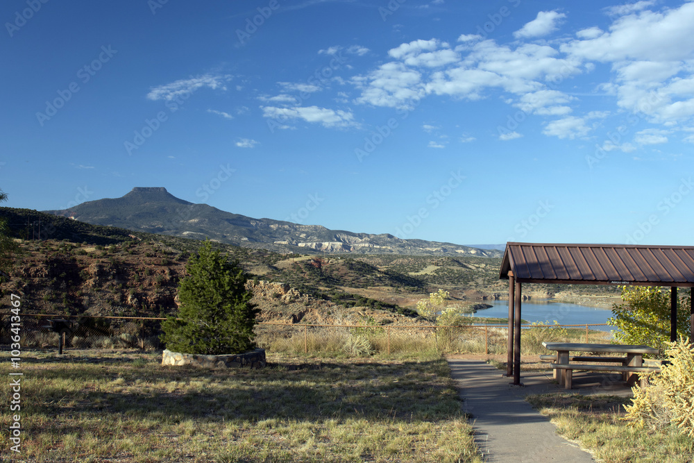 View of Cerro Pedernal and the picnic area at Abiquiu Lake, an Army Corps of Engineers reservoir in northern New Mexico, at dawn View of Cerro Pedernal and the picnic area at Abiquiu Lake, an Army Corps of Engineers reservoir in northern New Mexico, at dawn