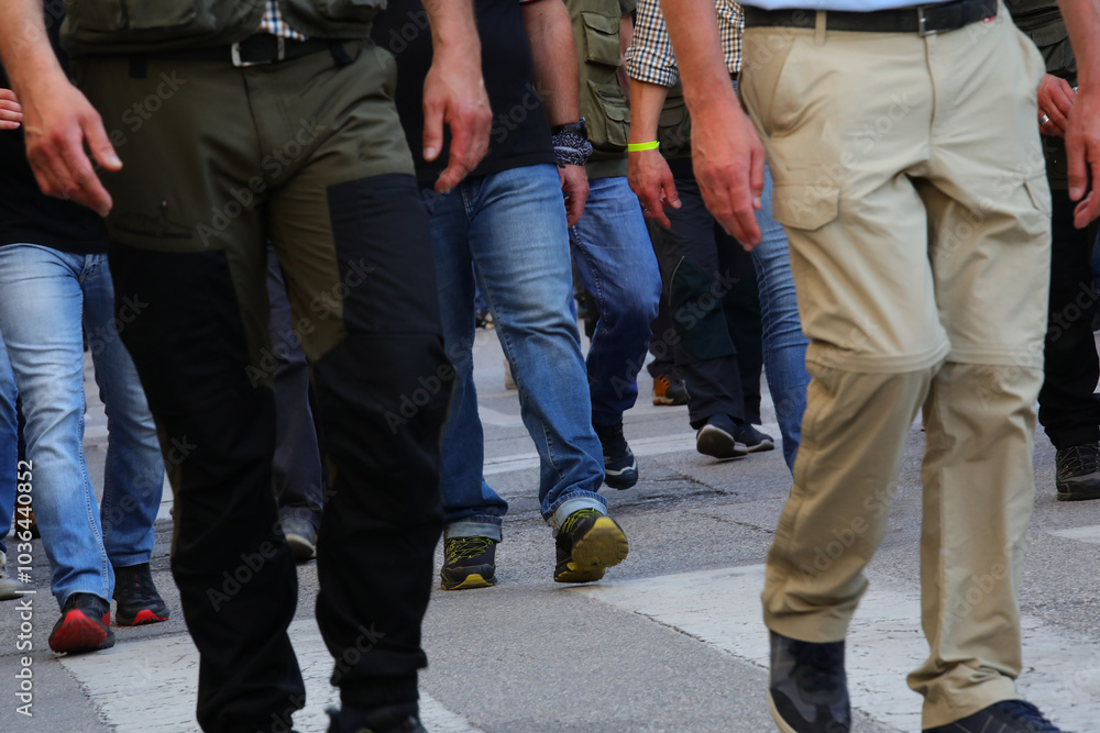 legs of people marching in a peaceful protest and strike legs of people marching in a peaceful protest and strike