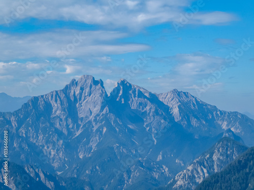 Wallpaper Mural Scenic view of majestic mountain range of Gesäuse, Ennstal Alps, Styria, Austria. Towering, jagged peaks rise up in Austrian Alps. Climbing and mountaineering in natural beauty. Wanderlust in summer Torontodigital.ca