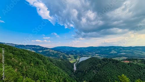 Breathtaking aerial view from Geierwand of alpine lake Stubenbergsee in Stubenberg, Styria, Austria. Surrounded by lush green forests and rolling hills of East Styrian Hill Country in Austrian Alps photo