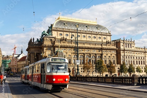 Wallpaper Mural A streetcar running on the tramway track thru Legion Bridge (Most Legii) over Vltava River with the landmark building of National Theater in backdrop on a beautiful sunny day in Praque Old Town, Czech Torontodigital.ca