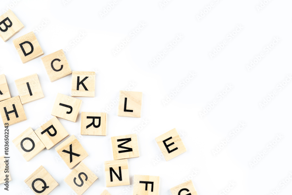 Wooden block with letters on a white background, top view. Wooden block with letters on a white background, top view.