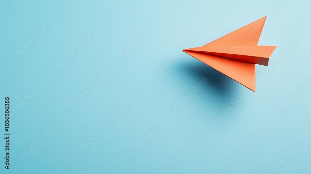 Orange paper airplane flying on a blue background. Orange paper airplane flying on a blue background.