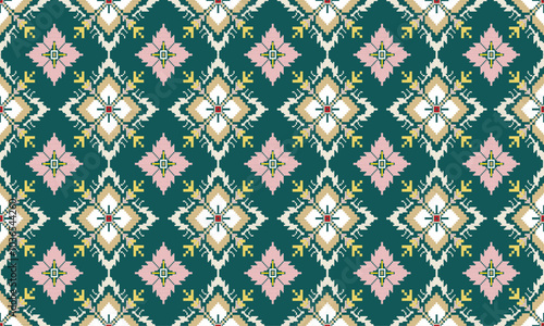 A complex, traditional textile pattern with intricate details. Predominantly green, pink, yellow, and white, the colors create a visually striking composition.