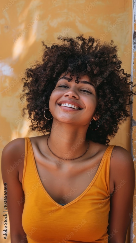 Confident Afro woman posing for a photo with a bright smile. Confident Afro woman posing for a photo with a bright smile.