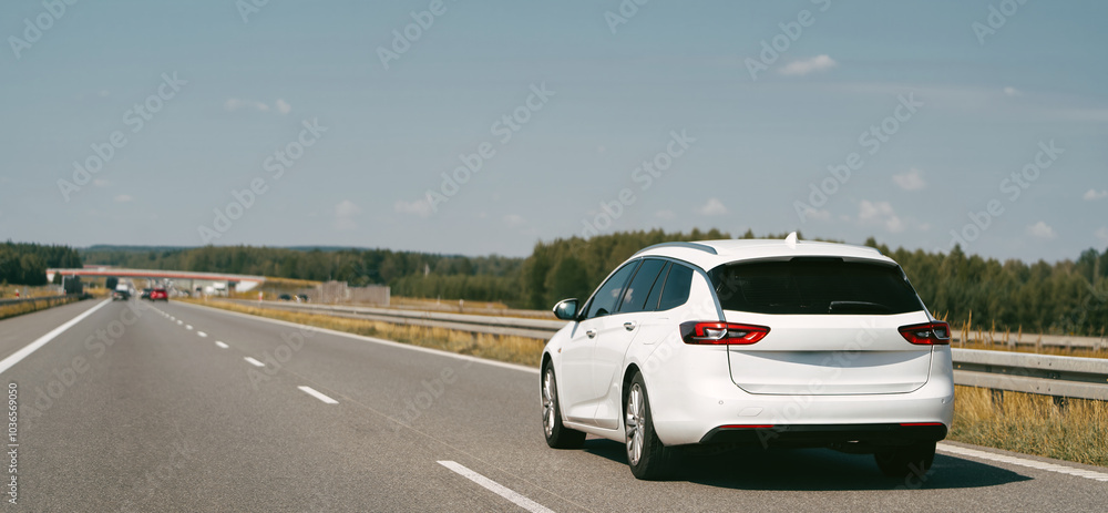 White combi car driving along the highway White combi car driving along the highway