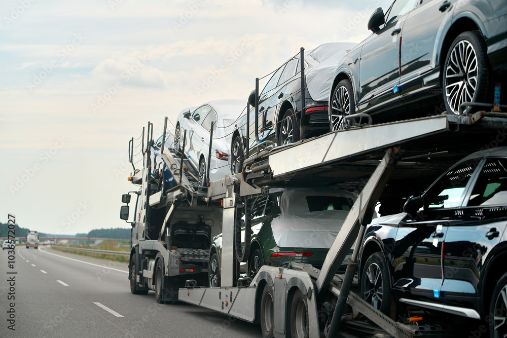 Naklejka premium Two-level car hauler with new SUVs