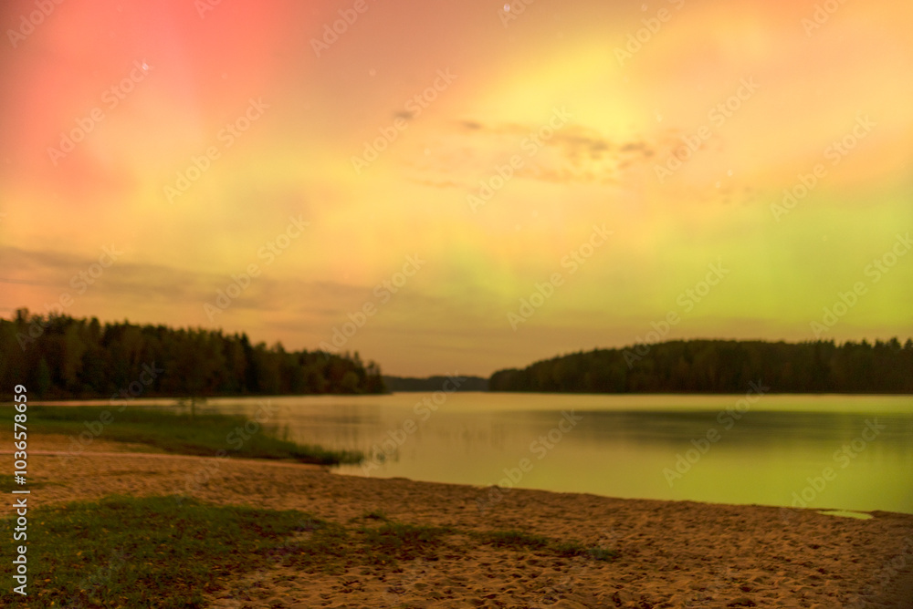 Obraz premium color photo with beautiful northern lights in the sky, northern lights over the lake