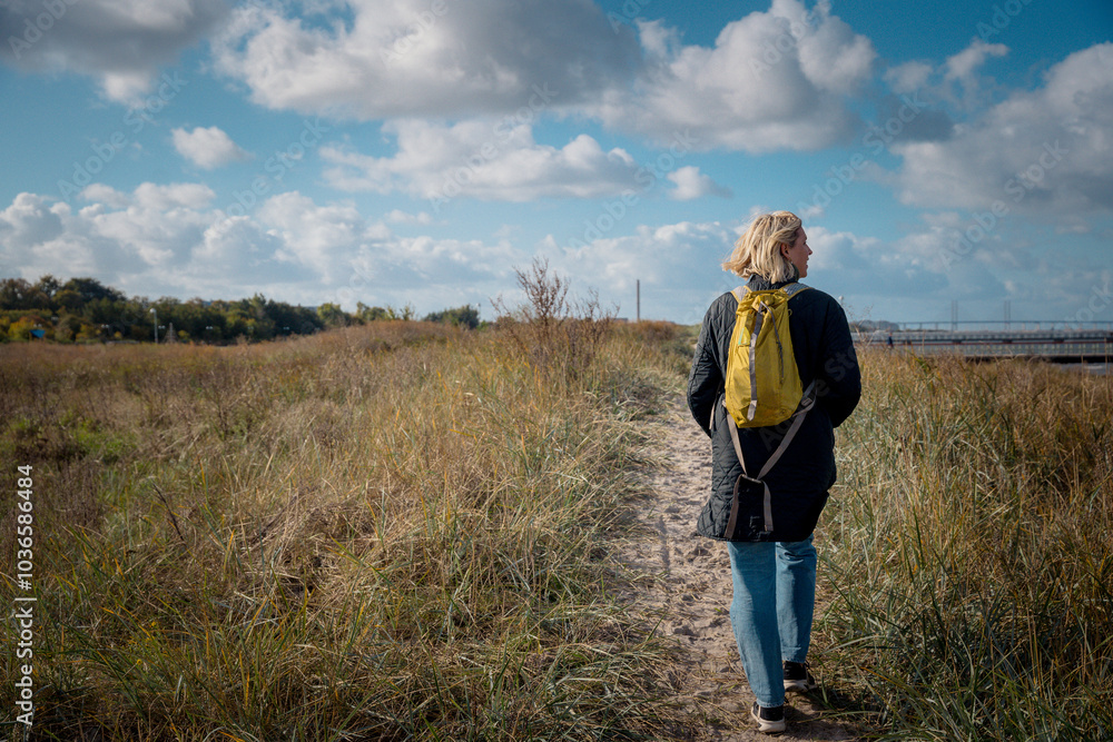 Female Tourist Exploring the Coastline in Sweden Female Tourist Exploring the Coastline in Sweden