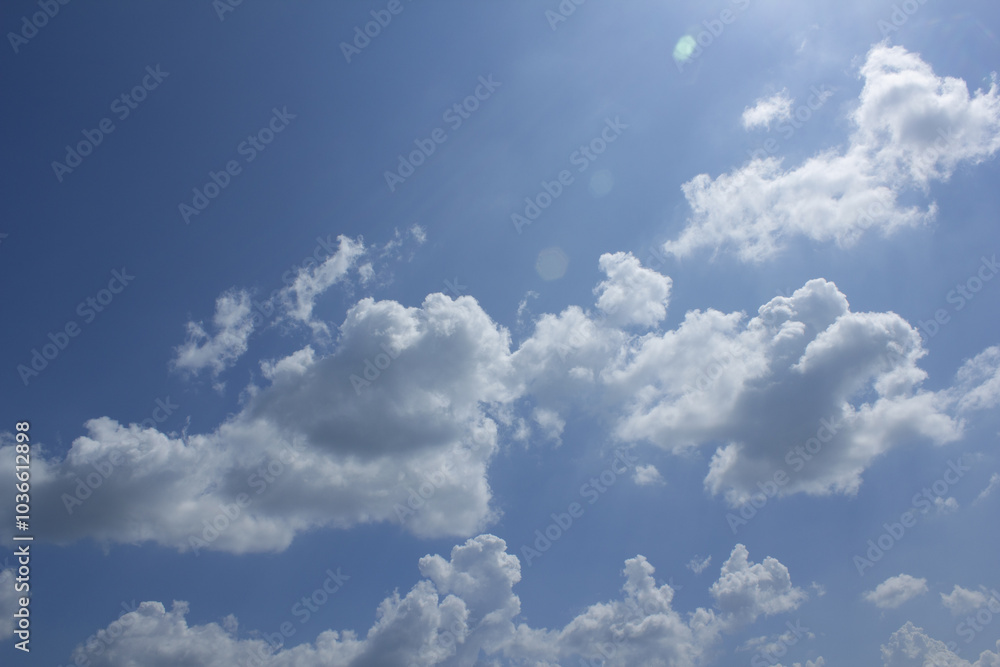 Blue sky with puffy clouds
Blue sky with puffy clouds