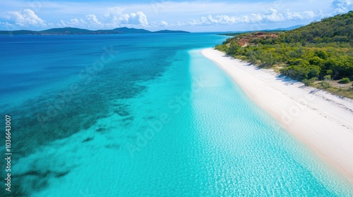 Blue tropical beach with turquoise waters, white sand, and clear skies