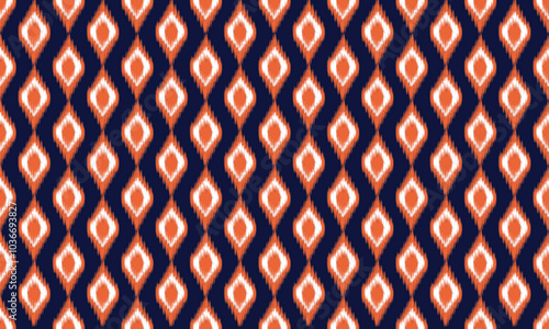 pattern geometric designs with orange and white on dark blue background , design for fabric or various pattern printing works.