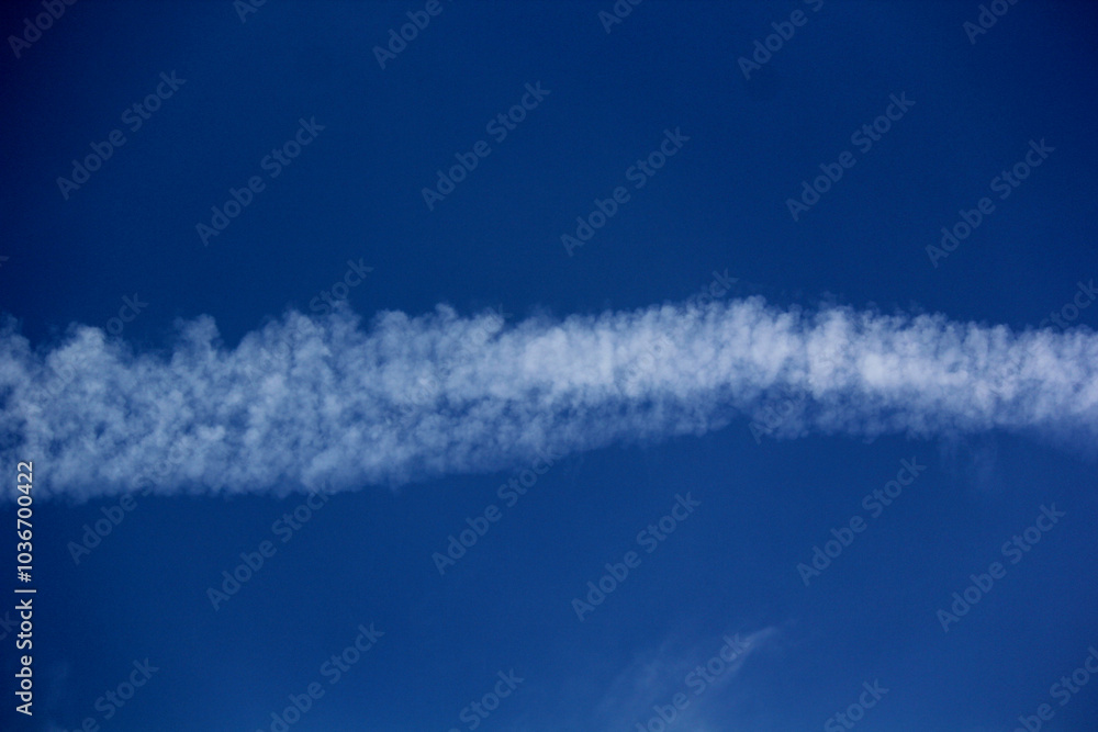 Landscape of plane tracks on a blue sky on a sunny day Landscape of plane tracks on a blue sky on a sunny day