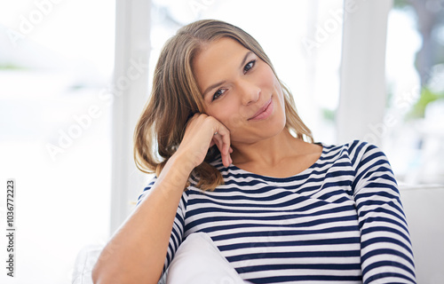 Portrait, house and woman on sofa, comfort and happiness with weekend break, relax and peaceful. Face, apartment and cheerful person on couch, girl and joyful with wellness, calm or resting in lounge