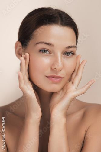 Canvas-taulu Portrait of a young woman with fresh glowing skin and a natural look