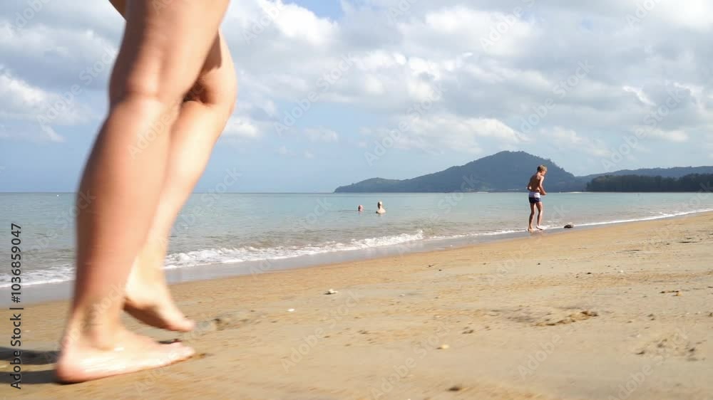 Girl runs along the beach barefoot Girl runs along the beach barefoot