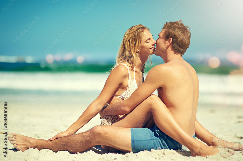 Couple, beach and kiss on holiday with love, hug and sitting on sand for honeymoon or vacation. Smile, embrace and happy people together in summer by ocean and sea with joy outdoor in Thailand Couple, beach and kiss on holiday with love, hug and sitting on sand for honeymoon or vacation. Smile, embrace and happy people together in summer by ocean and sea with joy outdoor in Thailand