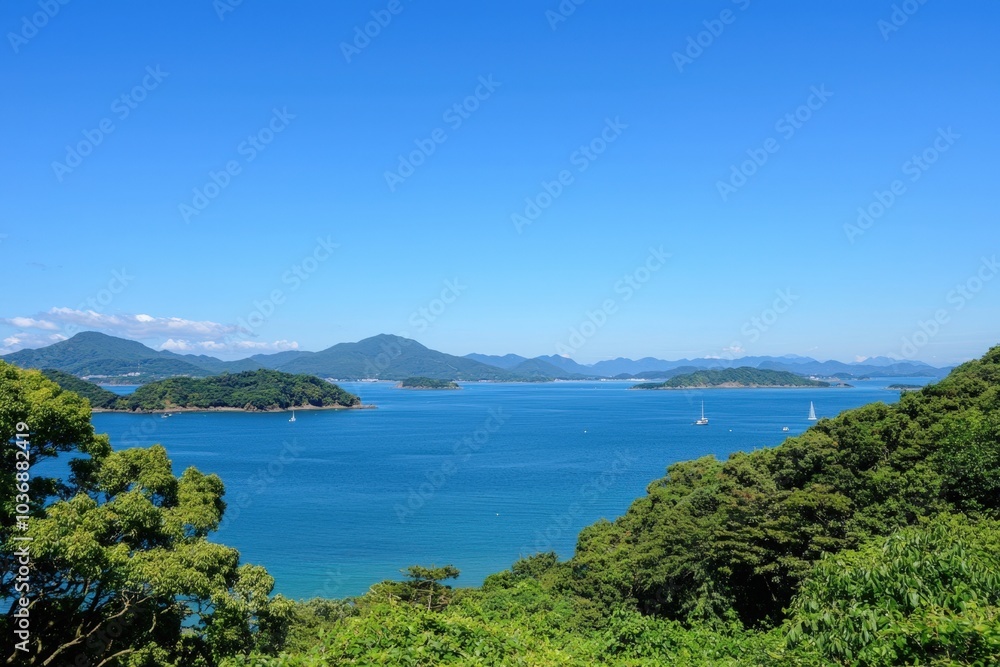 Serene coastal view of lush green hills meeting tranquil blue waters on a sunny day Serene coastal view of lush green hills meeting tranquil blue waters on a sunny day