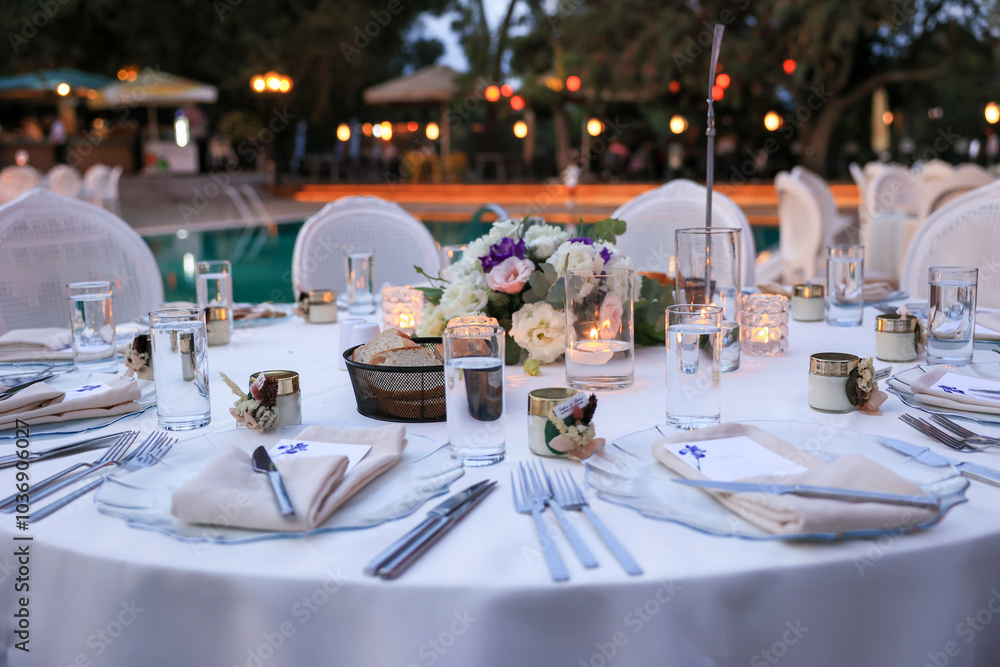 Luxury Wedding Venue: Beautifully Decorated Table with Candles and White Flowers