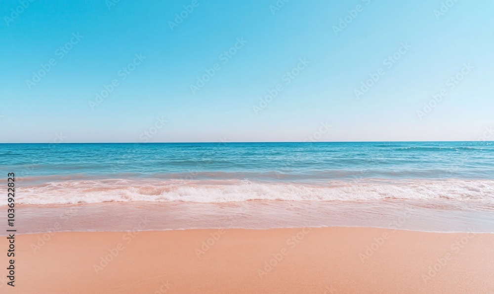 Serene beach scene with calm waves and clear blue sky. Serene beach scene with calm waves and clear blue sky.