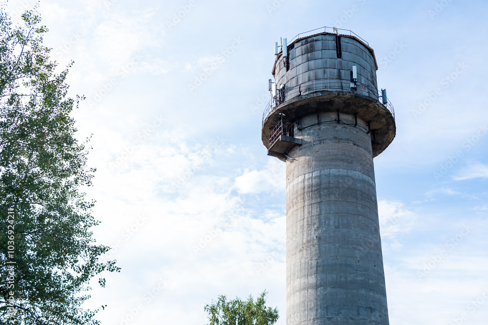 Old water tower with cell phone antennas. Old water tower with cell phone antennas.