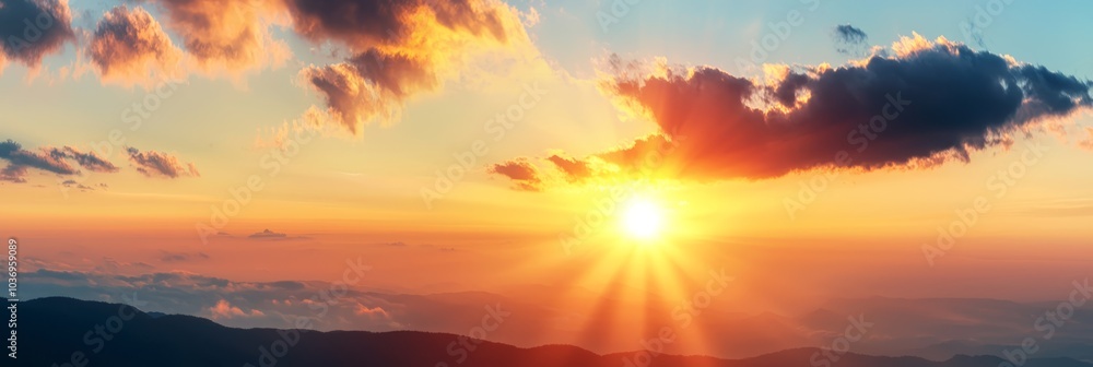 Fototapeta premium A bird flies before a sunset over mountains, clouded sky