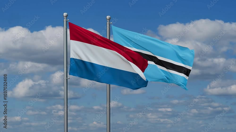Botswana and Luxembourg flags flying together, video concept of the relationship, two country relations concept Botswana and Luxembourg flags flying together, video concept of the relationship, two country relations concept