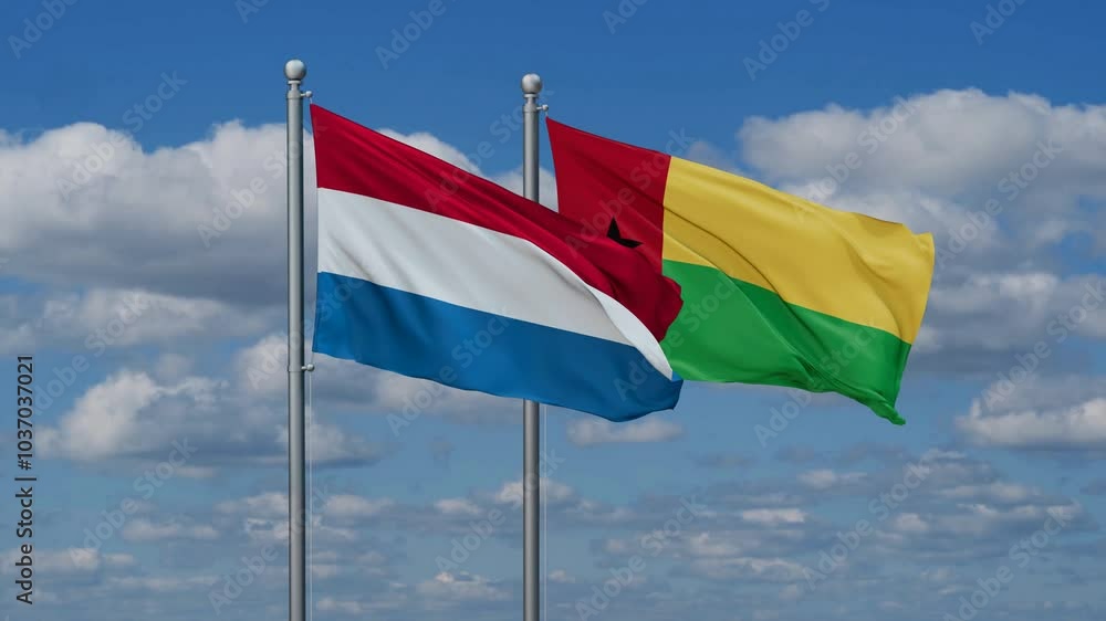 Guinea-Bissau and Luxembourg flags flying together, video concept of the relationship, two country relations concept Guinea-Bissau and Luxembourg flags flying together, video concept of the relationship, two country relations concept
