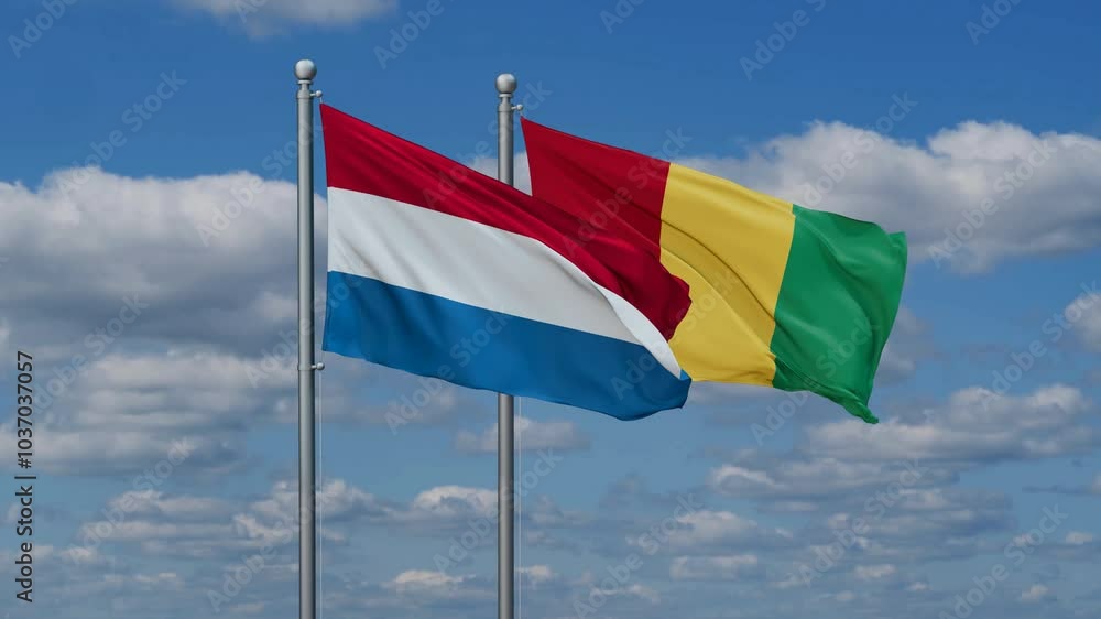 Republic of Guinea or Guinea-Conakry and Luxembourg flags flying together, video concept of the relationship, two country relations concept Republic of Guinea or Guinea-Conakry and Luxembourg flags flying together, video concept of the relationship, two country relations concept