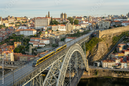 Porto City, Douro River and Dom Luis Bridge I with Tram in Morning. View from Tourist Viewpoint Miradouro da Serra do Pilar. Portugal. Medium Telephoto Shot
