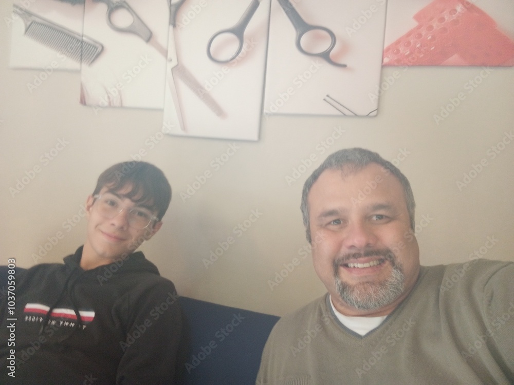 senior couple looking at camera in a barber shop