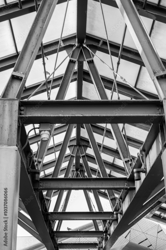 Heavy Gray Steel Beams on a Glass Sunroof. Heavy Gray Steel Beams on a Glass Sunroof.