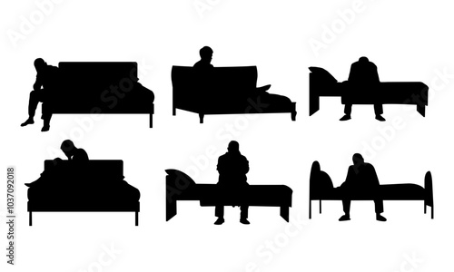 Silhouette of a six-depressed man sadly sitting on the bed in the bedroom. Sad man sitting on a single bed isolated on a white background.