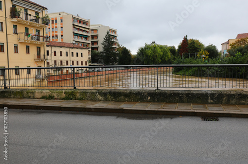 above the bridge called ponte pusterla in vicenza city in italy during the flood of the bacchiglione river mud colored photo