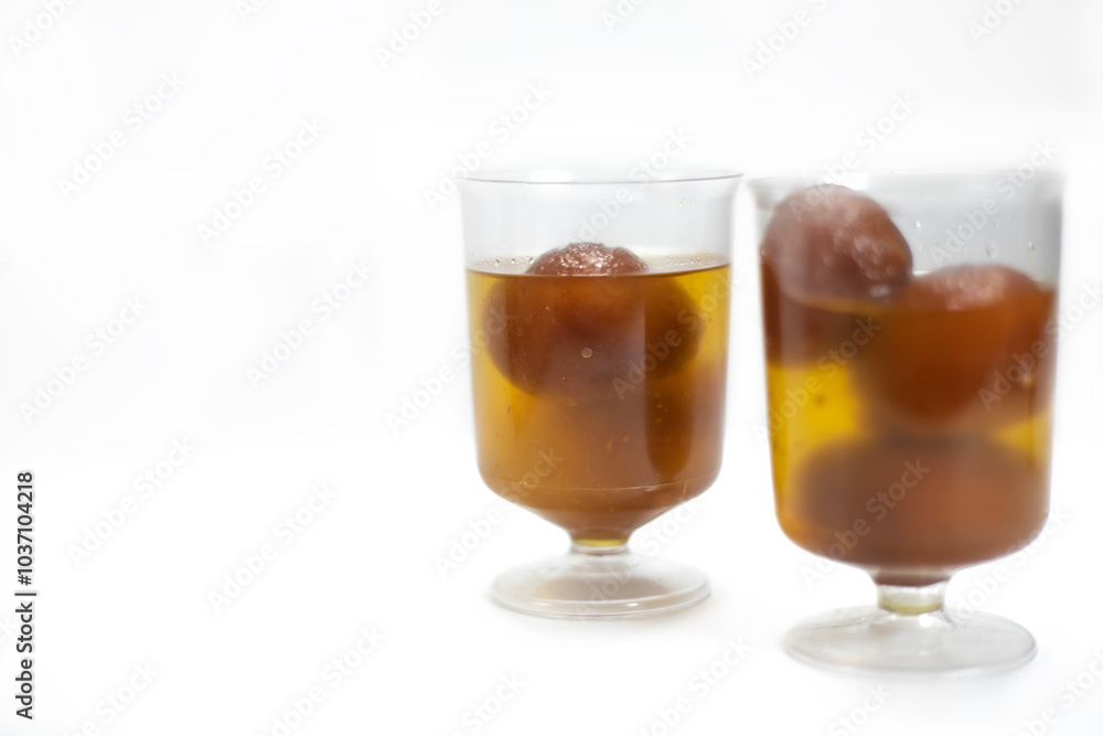 Indian dessert Gulab Jamun in transparent glass bowls. Indian dessert Gulab Jamun in transparent glass bowls.