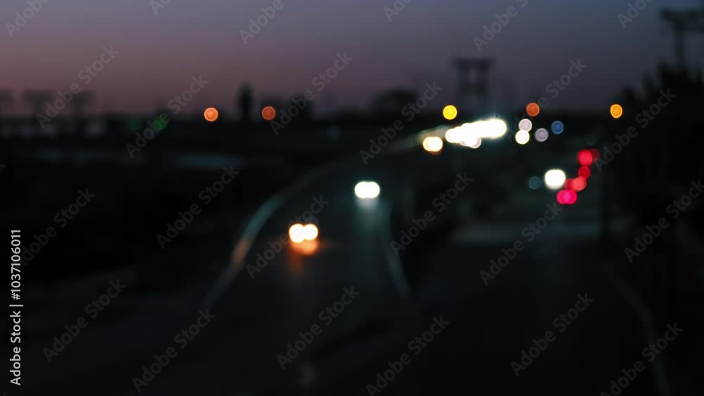 A beautifully blurred view of vibrant nighttime traffic showcases colorful light trails produced by cars traveling along an urban road, effectively creating a dynamic and lively city scene A beautifully blurred view of vibrant nighttime traffic showcases colorful light trails produced by cars traveling along an urban road, effectively creating a dynamic and lively city scene