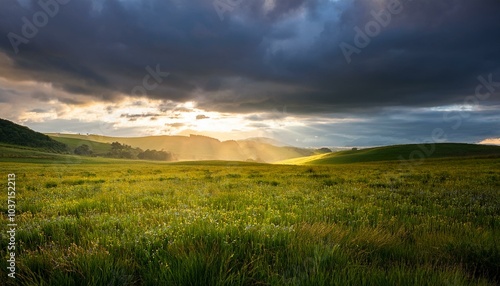 Sunlight penetrates the clouds, the contrast between the dark clouds and the light creates a feeling of hope that breaks through the gloom