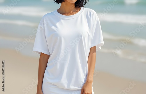 Oversized tshirt mockup in beach setting for fashion design. Mock up template for t-shirt design print area for design or logo. Blank white tshirt, female model mockup