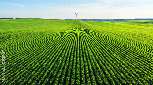 Vast green fields with a wind turbine a symbol of sustainable energy and natural beauty