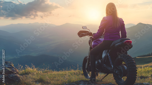 female biker in purple jacket enjoys scenic view from her motorcycle, surrounded by mountains and beautiful sunset. moment captures sense of adventure and freedom photo