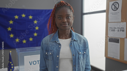 Young african woman indoors with european union flag, suggesting electoral or political theme photo