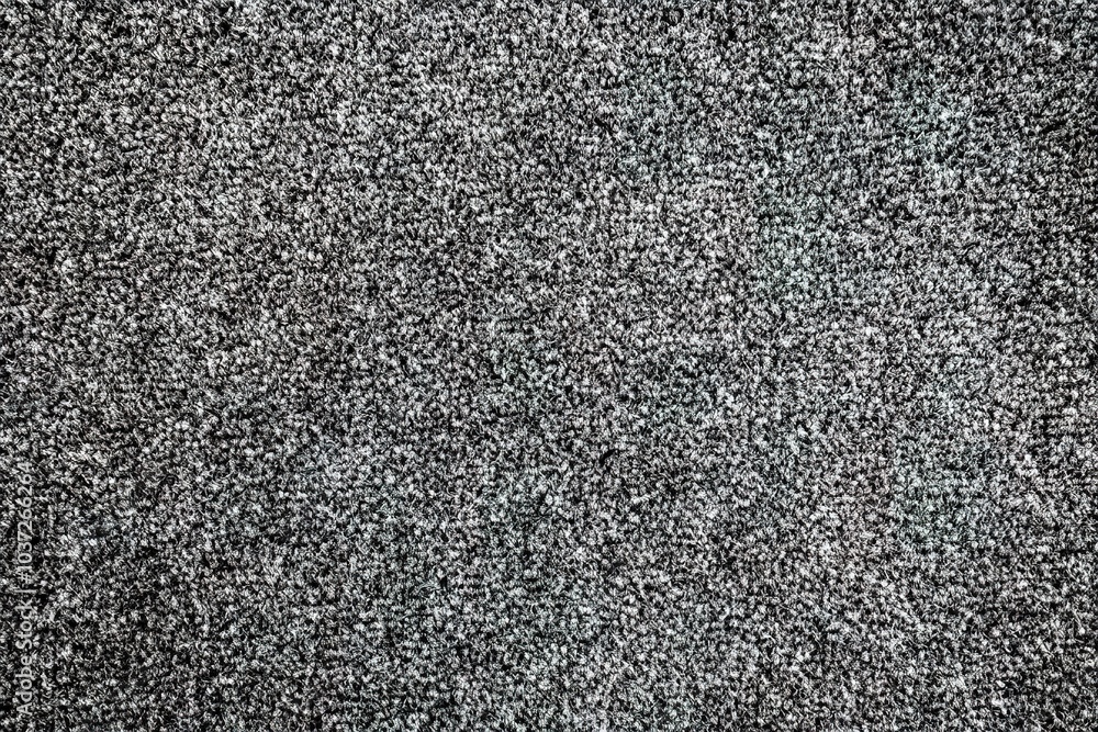 High-resolution photography of a top-down view of a soft, grey carpet with a plush pile texture High-resolution photography of a top-down view of a soft, grey carpet with a plush pile texture