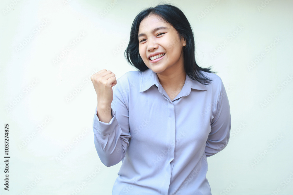 enthusiastic pretty asian young business woman raising fist pump say yes gesture look at camera, celebrating victory, winning and achievement with dance wear formal shirt isolated on white background enthusiastic pretty asian young business woman raising fist pump say yes gesture look at camera, celebrating victory, winning and achievement with dance wear formal shirt isolated on white background