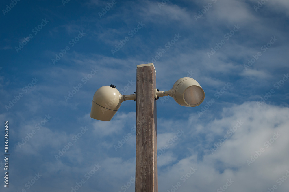 modern contemorary street lamp in a sunny day against a blue sky background modern contemorary street lamp in a sunny day against a blue sky background